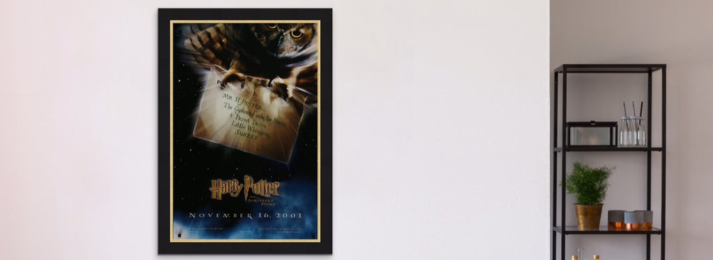 A framed movie poster for Harry Potter and the Philosopher's / Sorcerer's Stone