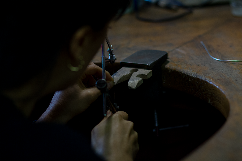 hana kim sawing metal pieces, workbench, jewellery making