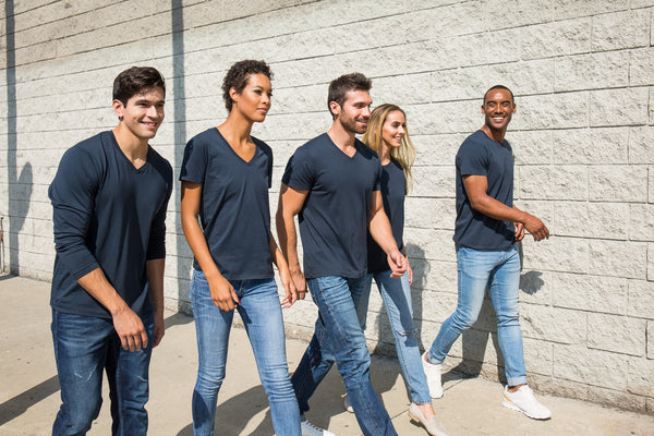 group of friends walking together wearing classic t shirts