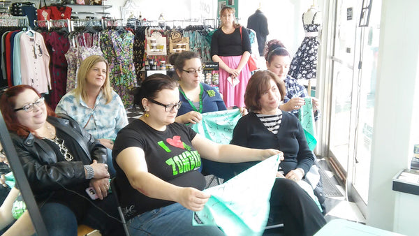 Folding bandanas at the Retro Hair For YOU in-store event 