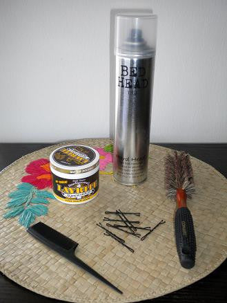 Soft bristle brush-I like to use the soft bristles to smooth the rolls out. Rat tail comb-For teasing when needed. Pomade or a smoothing finishing cream-I steal my hubbys Layrite. Hair spray-I like it strong, like my coffee! Bobby pins-Pick closest your your hair color.