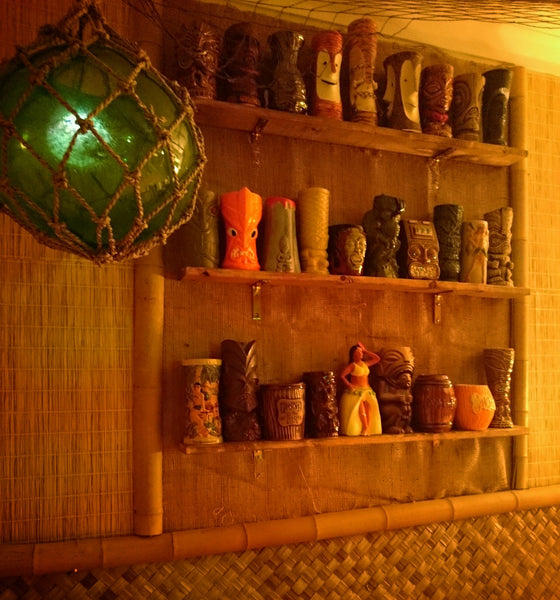 Fishing globe and Tiki mugs on wall The Lime Lounge
