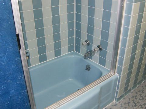 A retro renovation, save the blue bathroom. Tiled bathtub area