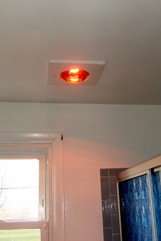 A retro renovation, save the blue bathroom. Heat lamp.