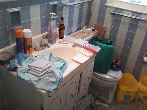 A retro renovation, save the blue bathroom. The sink area.