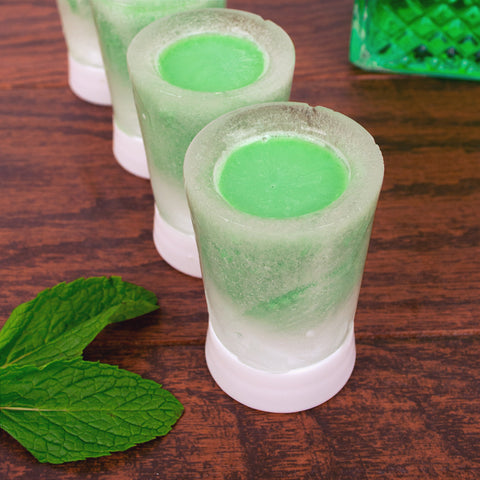 Image of several Green Shamrock Shots in ice-based shot glasses created using ZOKU's Shoot Ice Molds