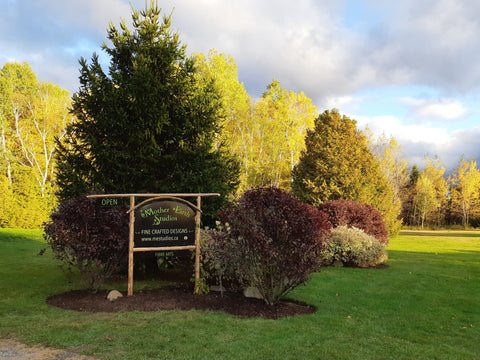 Entrance sign in trees garden