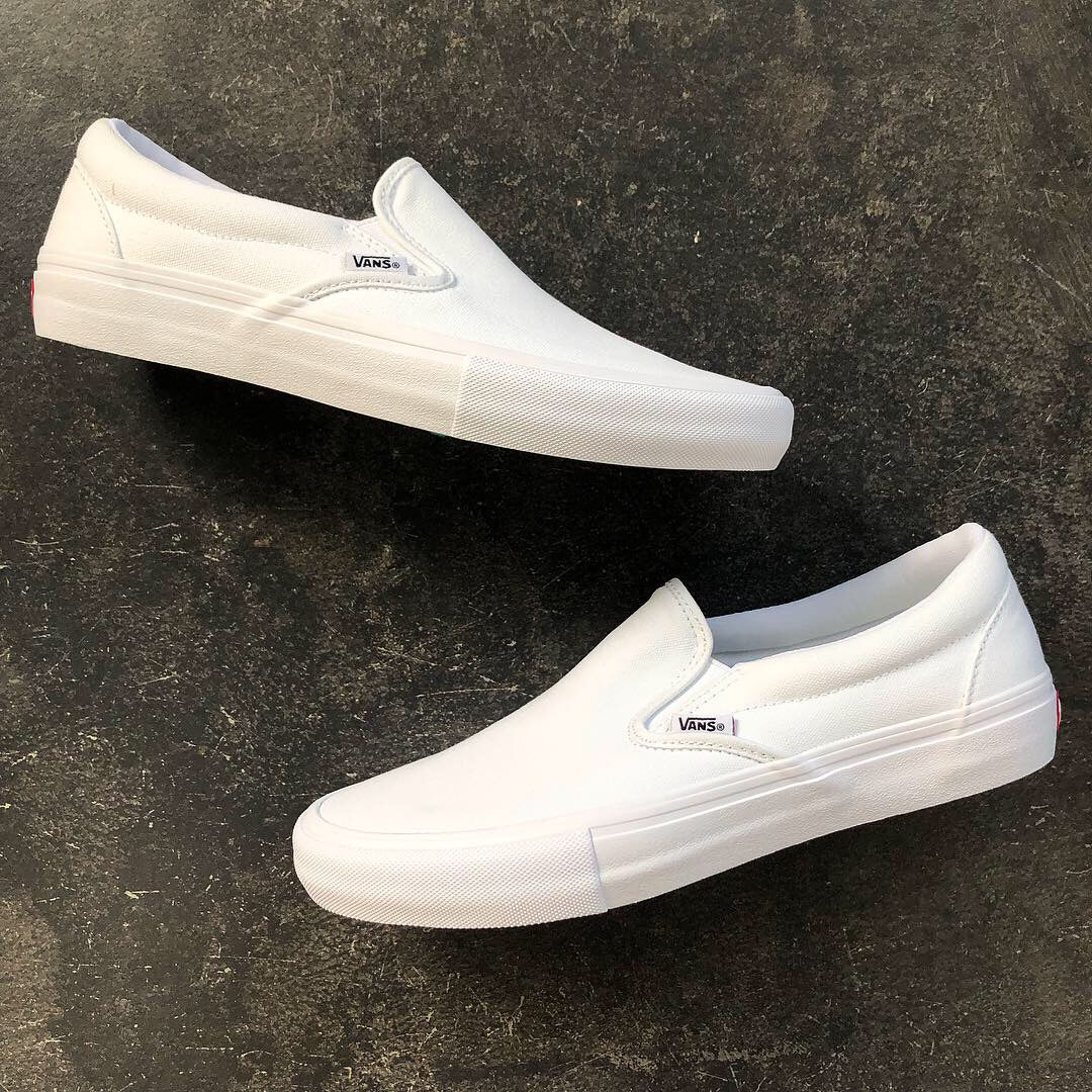 vans white canvas slip on