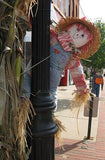 A Scarecrow Behind a Lamp Post