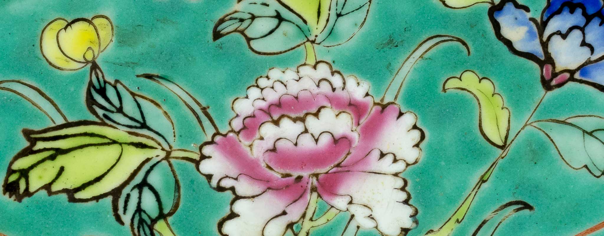 Closeup image of pottery with flowers on it