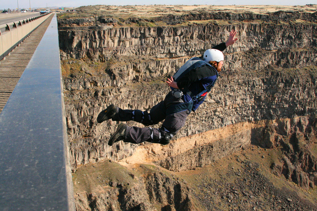 BASE jumper jumping off bridge