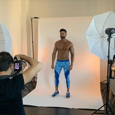 muscular shirtless man posing in a Studio