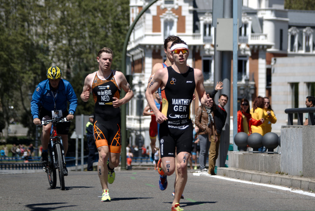 Triathlon, people running the marathon on the streets of Spain