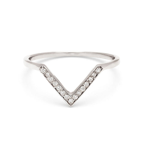 A band with 9 round white diamonds set in white gold. 4