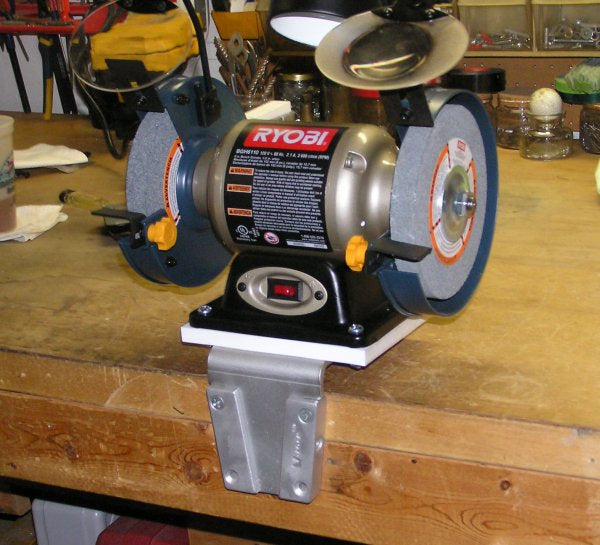 Attach a grinder to the work bench