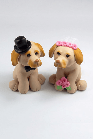 Custom made clay wedding cake toppers shaped as two family dogs