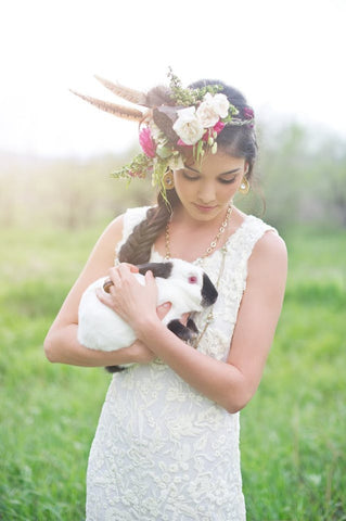 Lovely Bride in Wedding Dress and Floral Hair Piece Holding Pet Bunny Rabbit for Photo by Shannon Von Eschen 