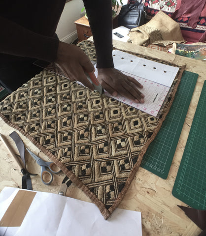 Kuba fabric being cut