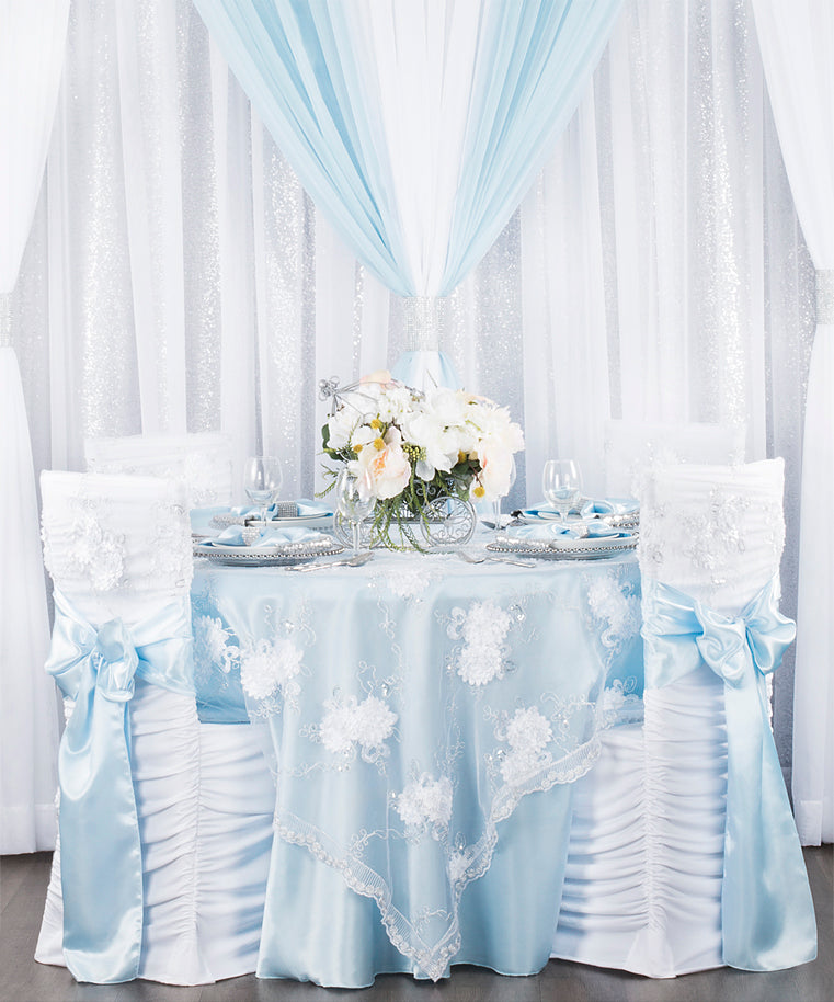 fairy tale baby shower cinderella theme with white flowers and baby blue tablecloth