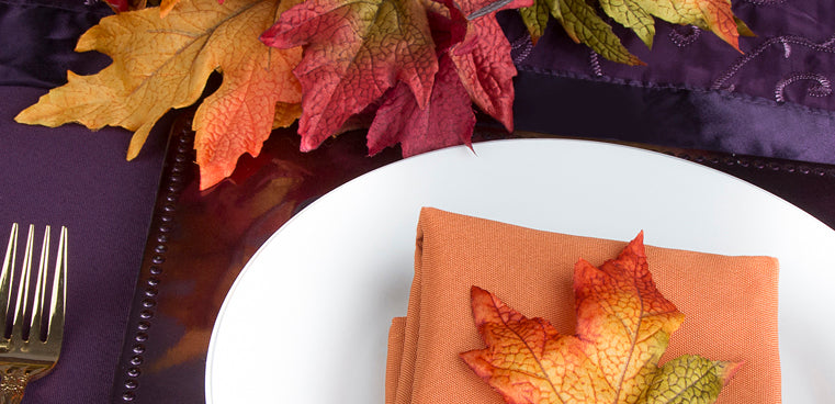 Plum Polyester Tablecloth with Orange Polyester Napkin and Plum Charger Plate