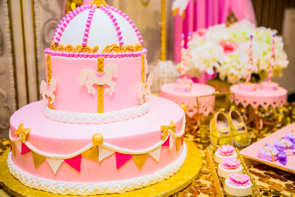 Princess carousel baby shower with pink, lavender, and gold sequins