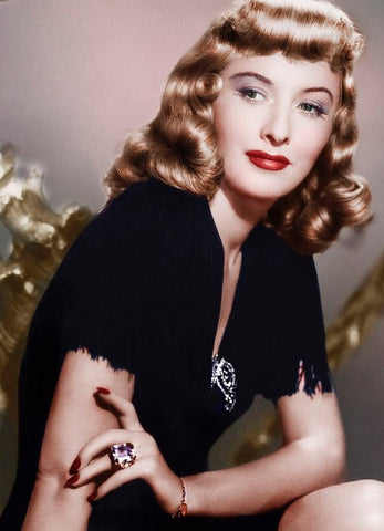 Barbara Stanwyck in the 40s - wearing a brooch 