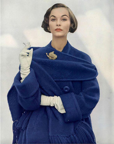 Photo of a 1950s woman with a blue coat