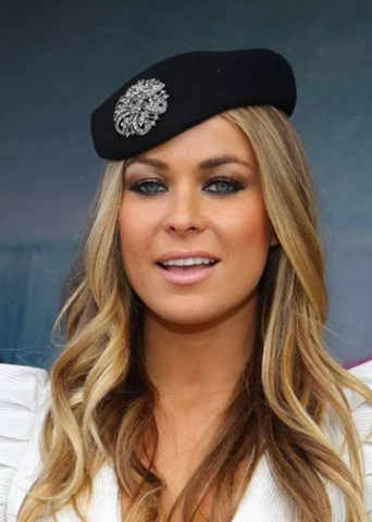 Carmen Electra - wearing a hat and brooch - Getty Images