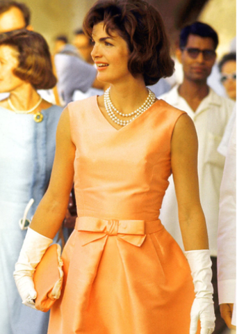 Jackie wearing an Oleg Cassini Dress