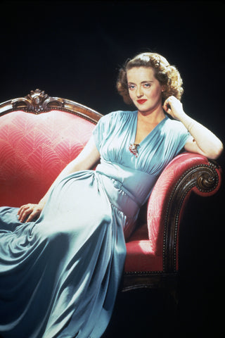 Bette Davis - blue dress and red brooch