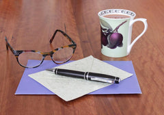 Photo of man size pen with mug and eyeglasses