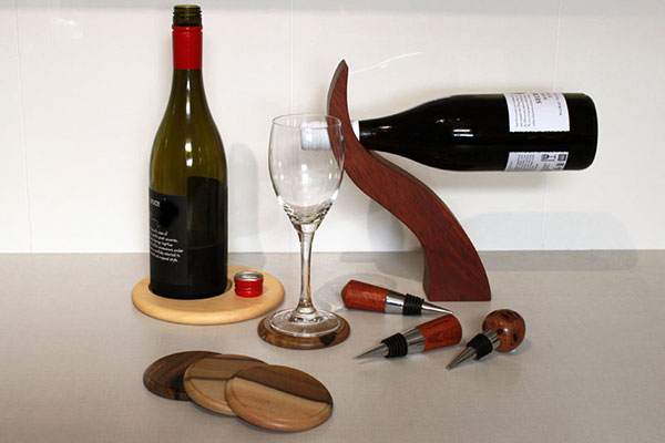 Photo of coaster with wine bottle balance and wine stopper