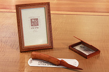 Photo of set of mixed timber photo frame, folding letter opener and business card holder