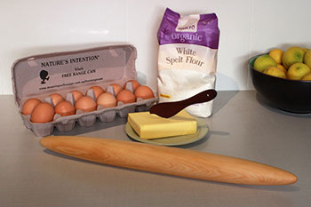 Photo of French style rolling pin with egg, flour, and butter