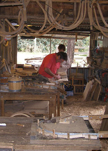 Greg in the woodshed making a chair