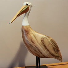 Photo of Wood Pelican Standing Tall