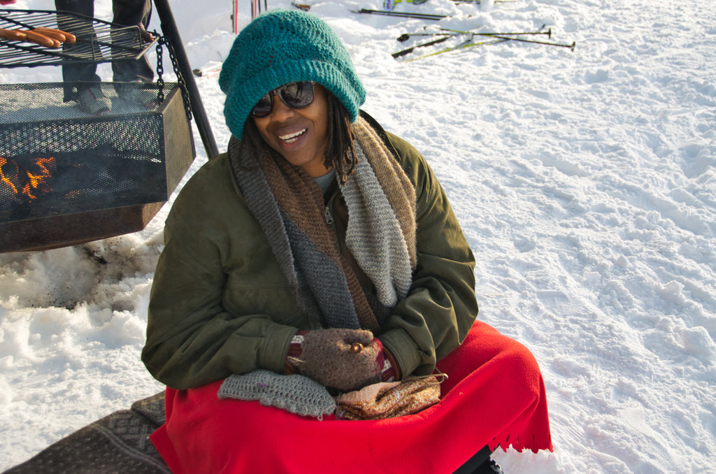 Marce crocheting by the fire