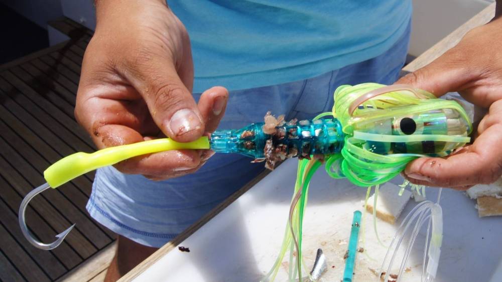 Rigging sleeve rigged to a trolling lure.