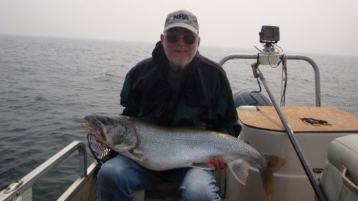 Dale Bisson lake trout using a trolling lure.