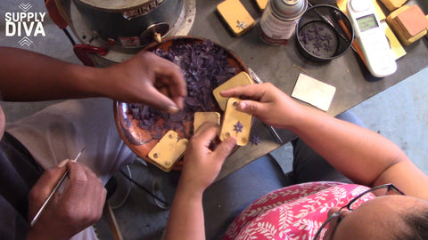 Lulu and Alberto cleaning wax for casting