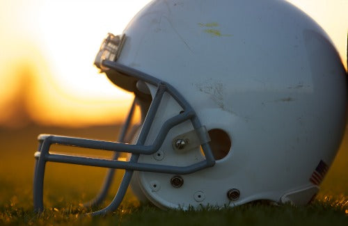 Snap Decision by Nathan Whitaker 9780310737001,American Football Helmet on the Field at Sunset