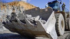 Bucket loader filled with limestone for making cement