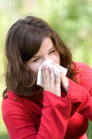 woman sneezing