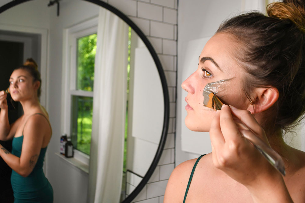 Woman Applies Natural Facial Mask made by Source Vital Apothecary