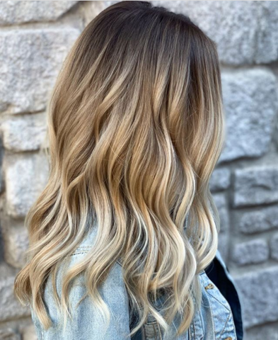 Woman with brown hair with blonde balayage