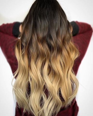Woman with long, ombre hair that goes from brown to blonde