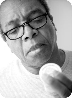 Man reads ingredients on a Wonderfeel CBD label