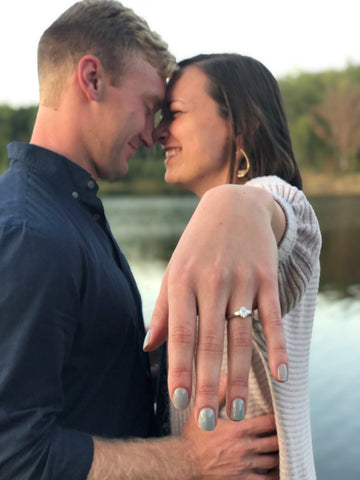 Engagement Photo of Woman Holding out her Hand with Engagement Ring