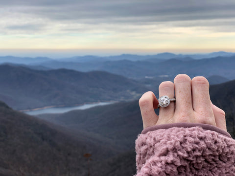 Woman Hold up Hand with Custom Designed Engagement Ring Using an Heirloom Diamond
