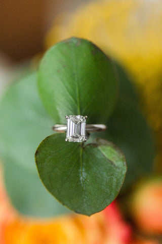White Gold Four-Prong Engagement Ring with Emerald Cut Center Stone